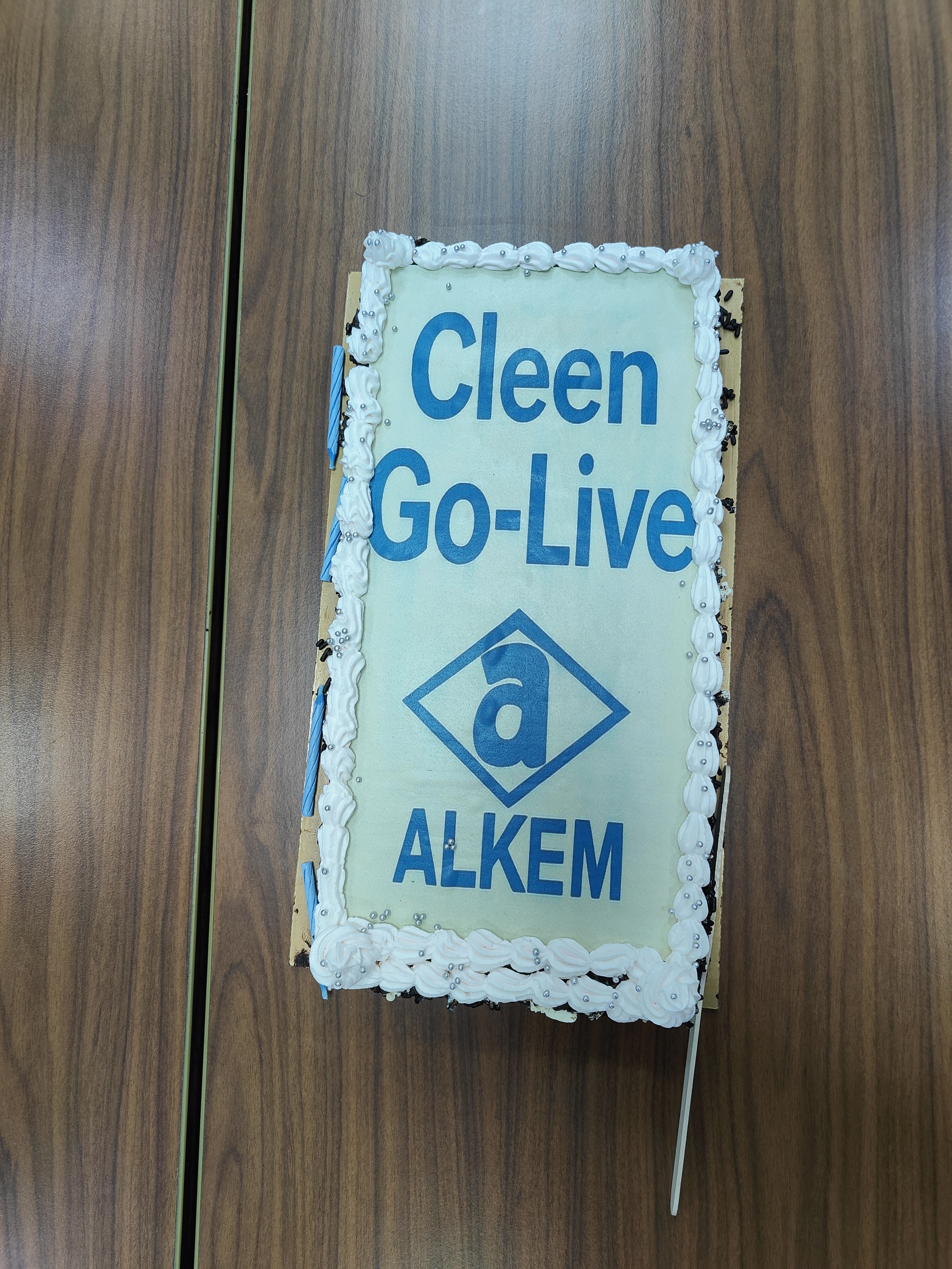 CLEEN Go-Live celebration cake with Alkem branding